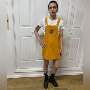 Upcycled corduroy jumper dress with hand embroidered vegan mushroom patch